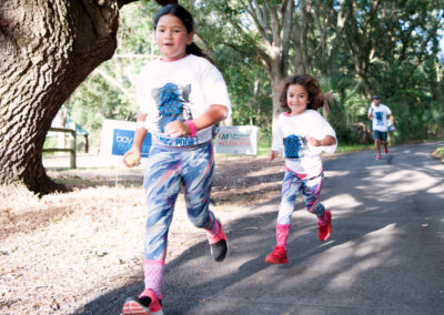 Two Young Girl Jogging Along