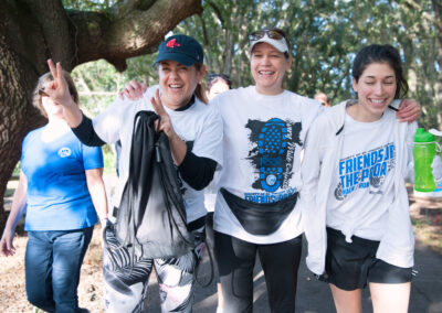 Happy Women Strolling Along a Trail